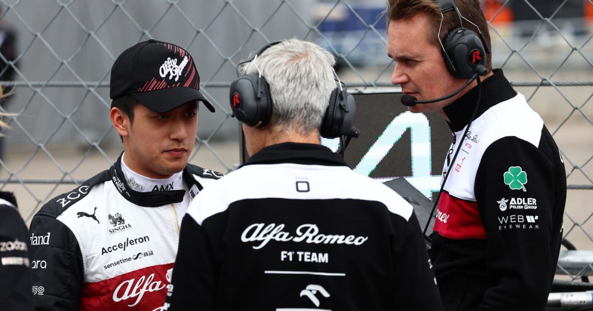 Zhou Guanyu speaking with Alfa Romeo engineers before the race. Hungary July 2022