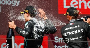 Lewis Hamilton sprays George Russell in the back. France July 2022