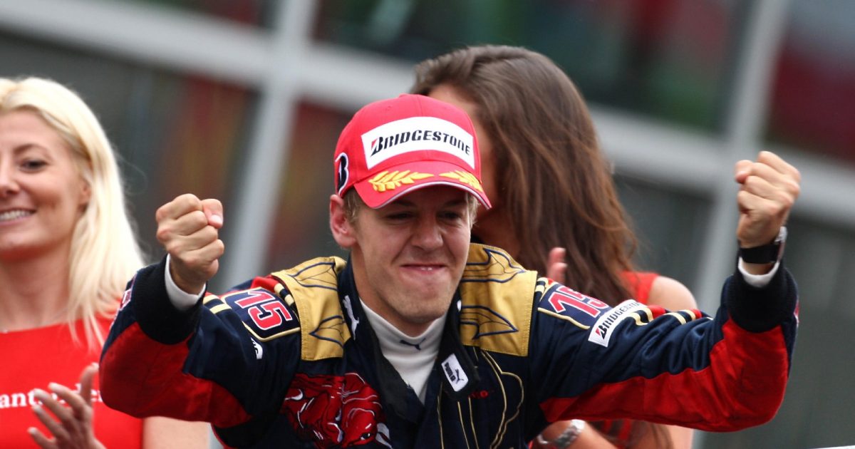 Sebastian Vettel, Toro Rosso, celebrates on the podium at Monza. Italy, September 2008.