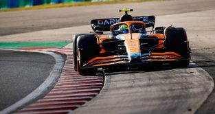 Lando Norris's McLaren goes beyond track limits. Hungaroring July 2022.
