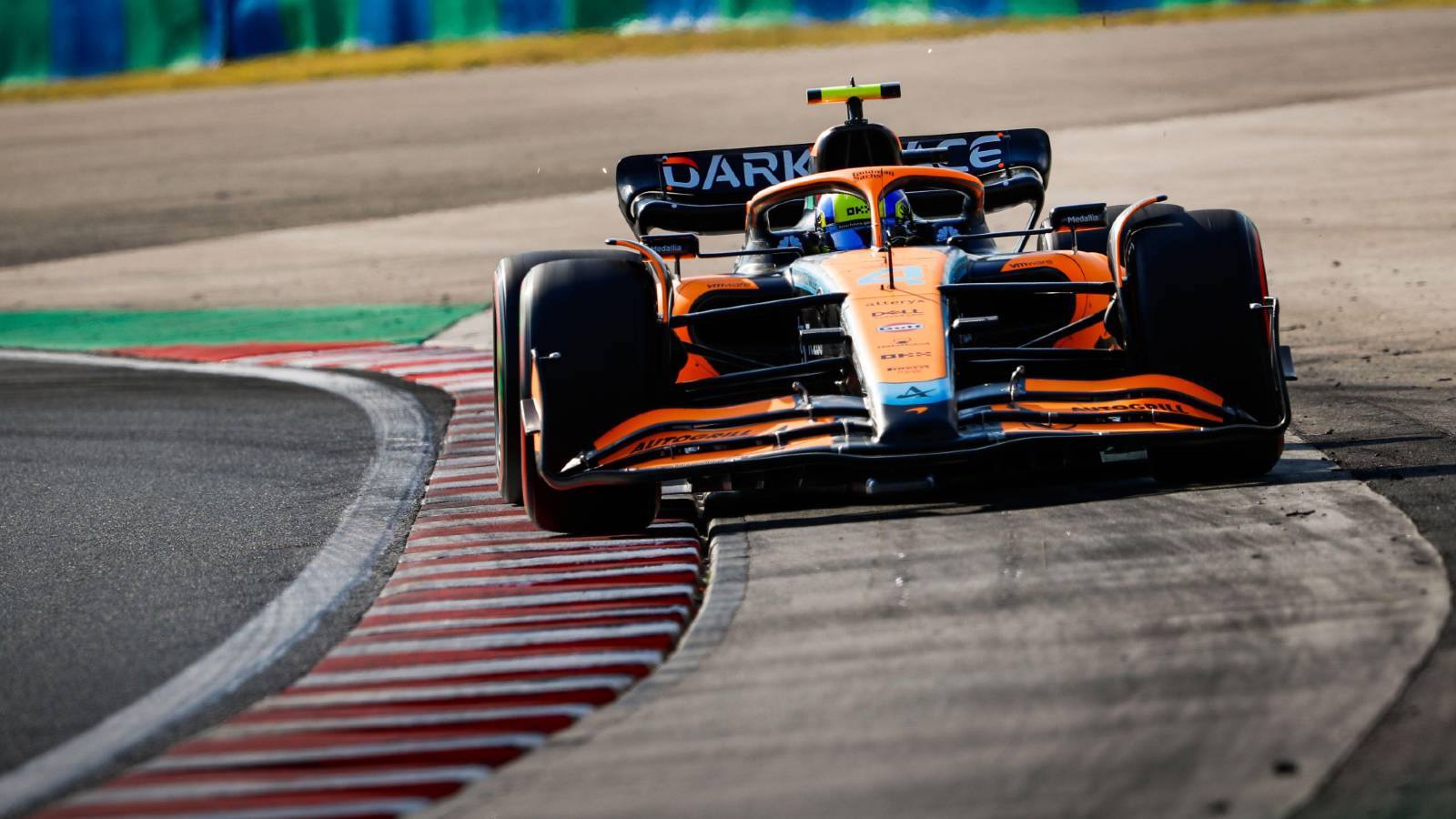 Lando Norris's McLaren goes beyond track limits. Hungaroring July 2022.