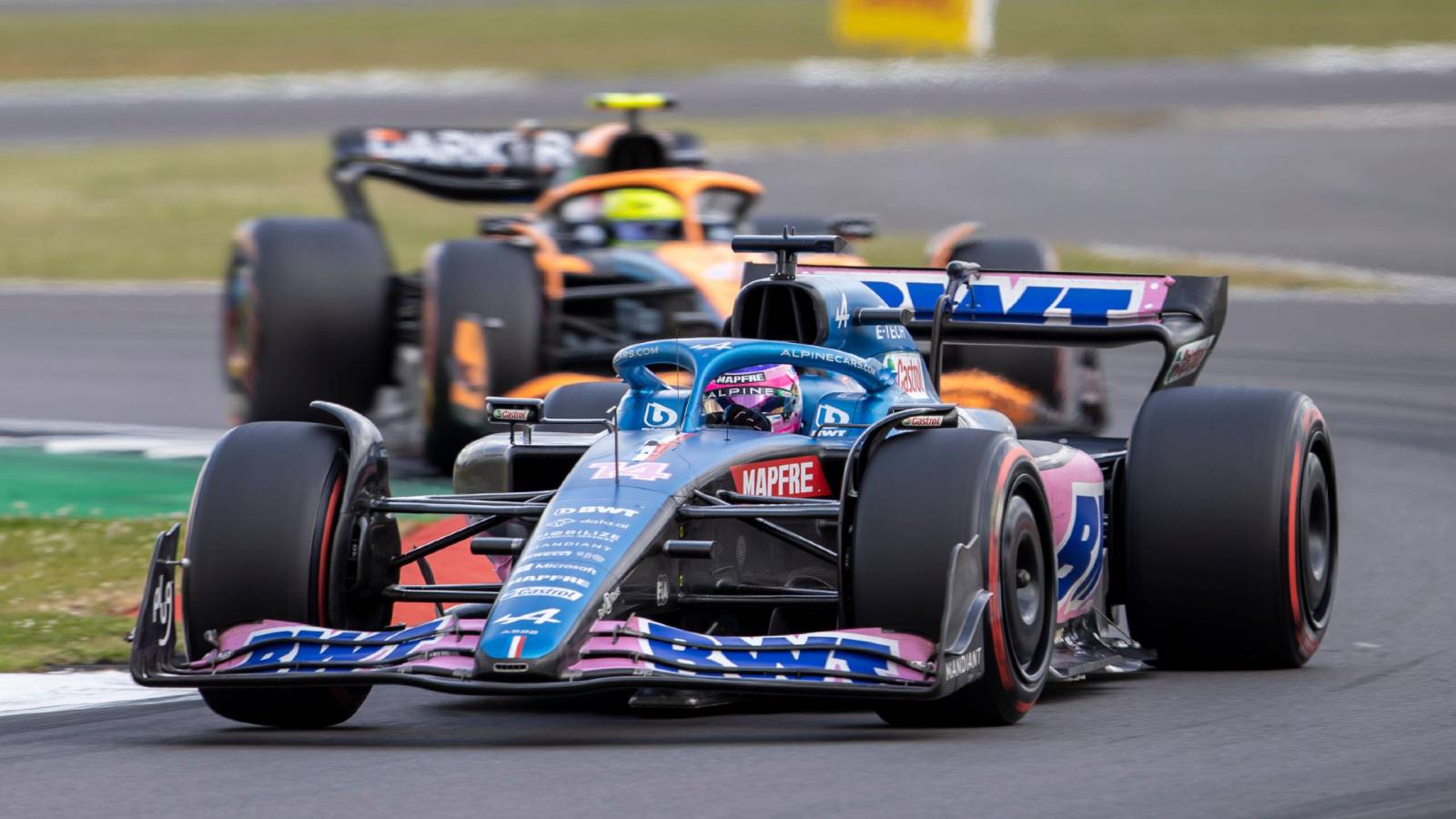 Fernando Alonso ahead of Lando Norris. Silverstone July 2022.