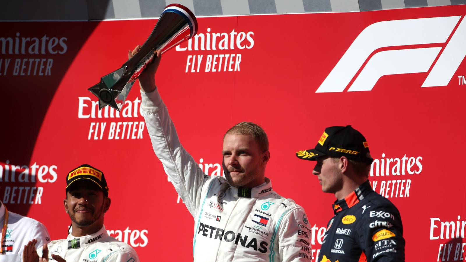 Valtteri Bottas celebrates a victory on the podium.