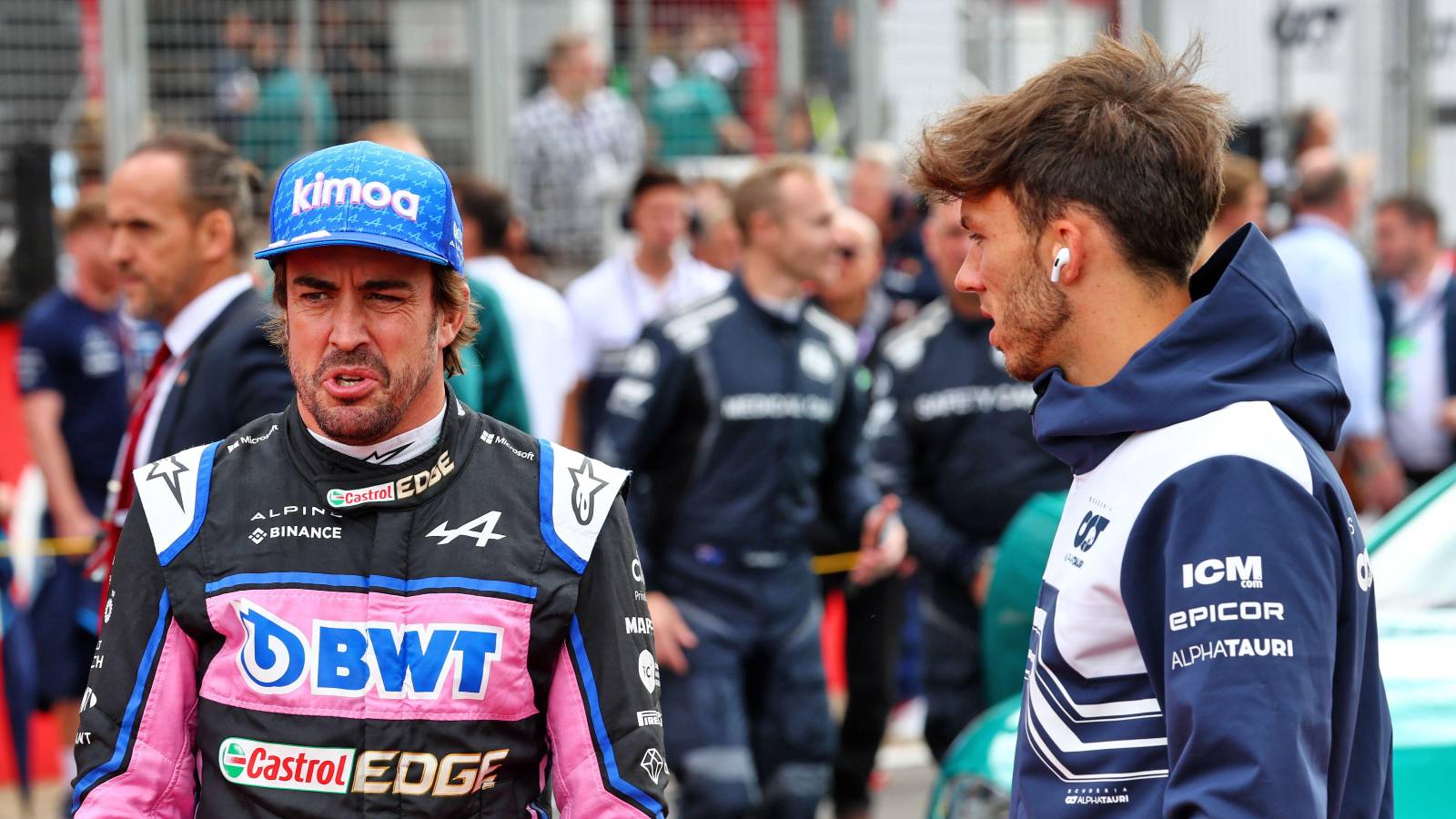 Fernando Alonso standing with Pierre Gasly. Silverstone July 2022.