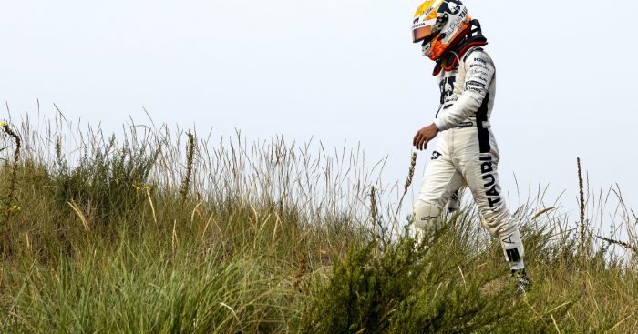 AlphaTauri's Yuki Tsunoda walks back to the pits after retiring from the Dutch Grand Prix. Zandvoort, September 2022.