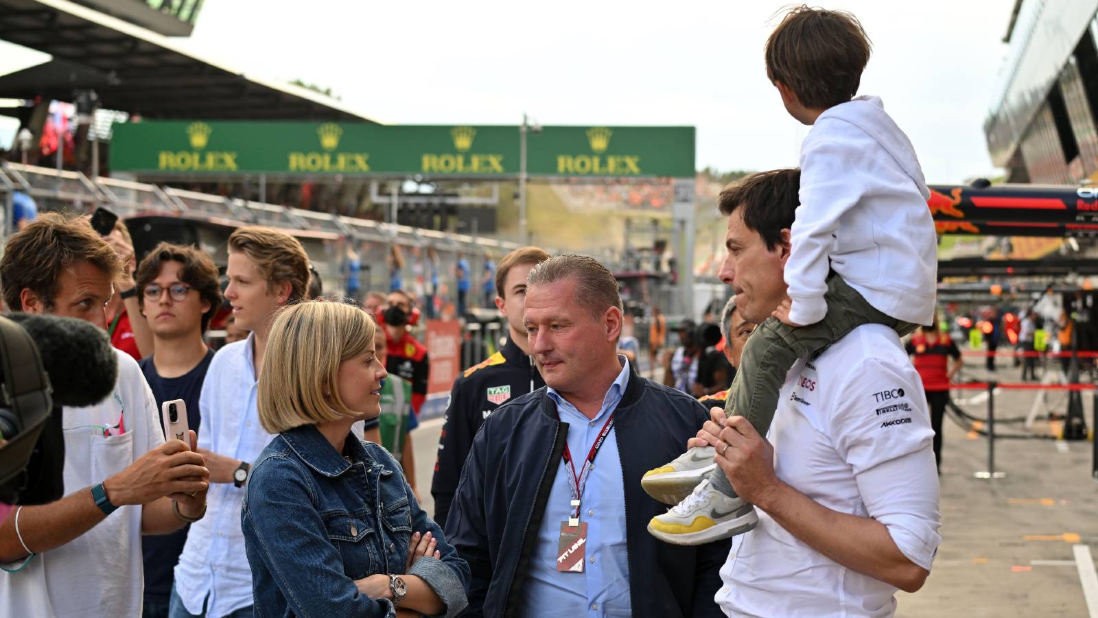 Jos Verstappen talking to Susie Wolff and Toto Wolff. Red Bull Ring July 2022.