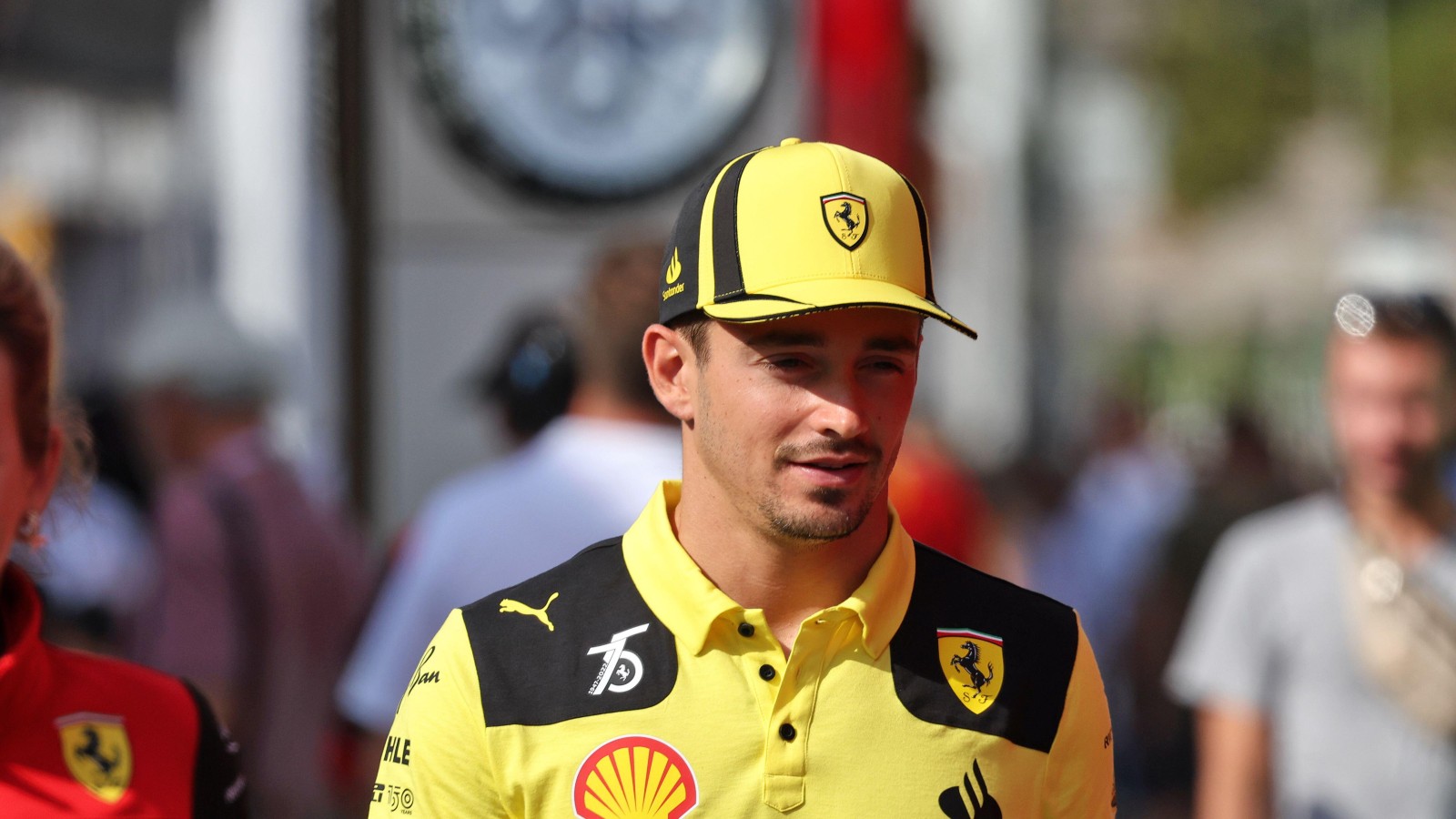 Charles Leclerc, Ferrari, wearing the celebratory yellow Ferrari clothing. Italy, September 2022.