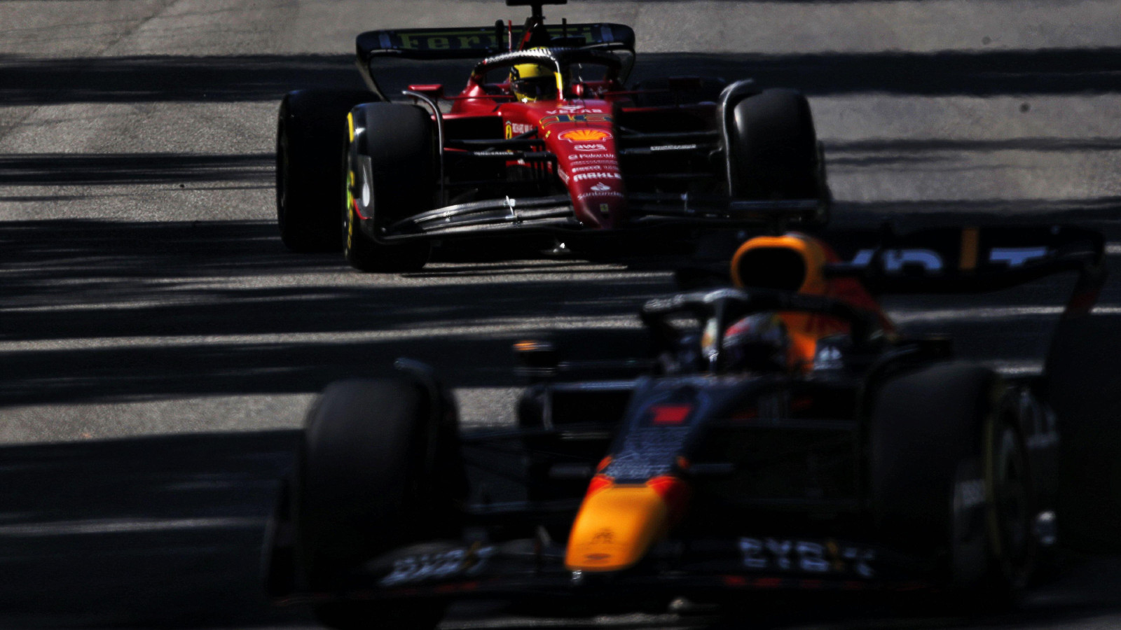 Ferrari's Charles Leclerc with Red Bull's Max Verstappen on track at the Italian Grand Prix. Monza, September 2022.