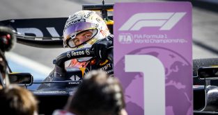 Max Verstappen peaking around the number 1 board. Italy September 2022