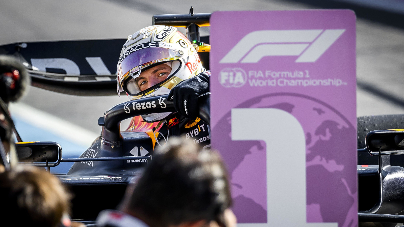 Max Verstappen peaking around the number 1 board. Italy September 2022