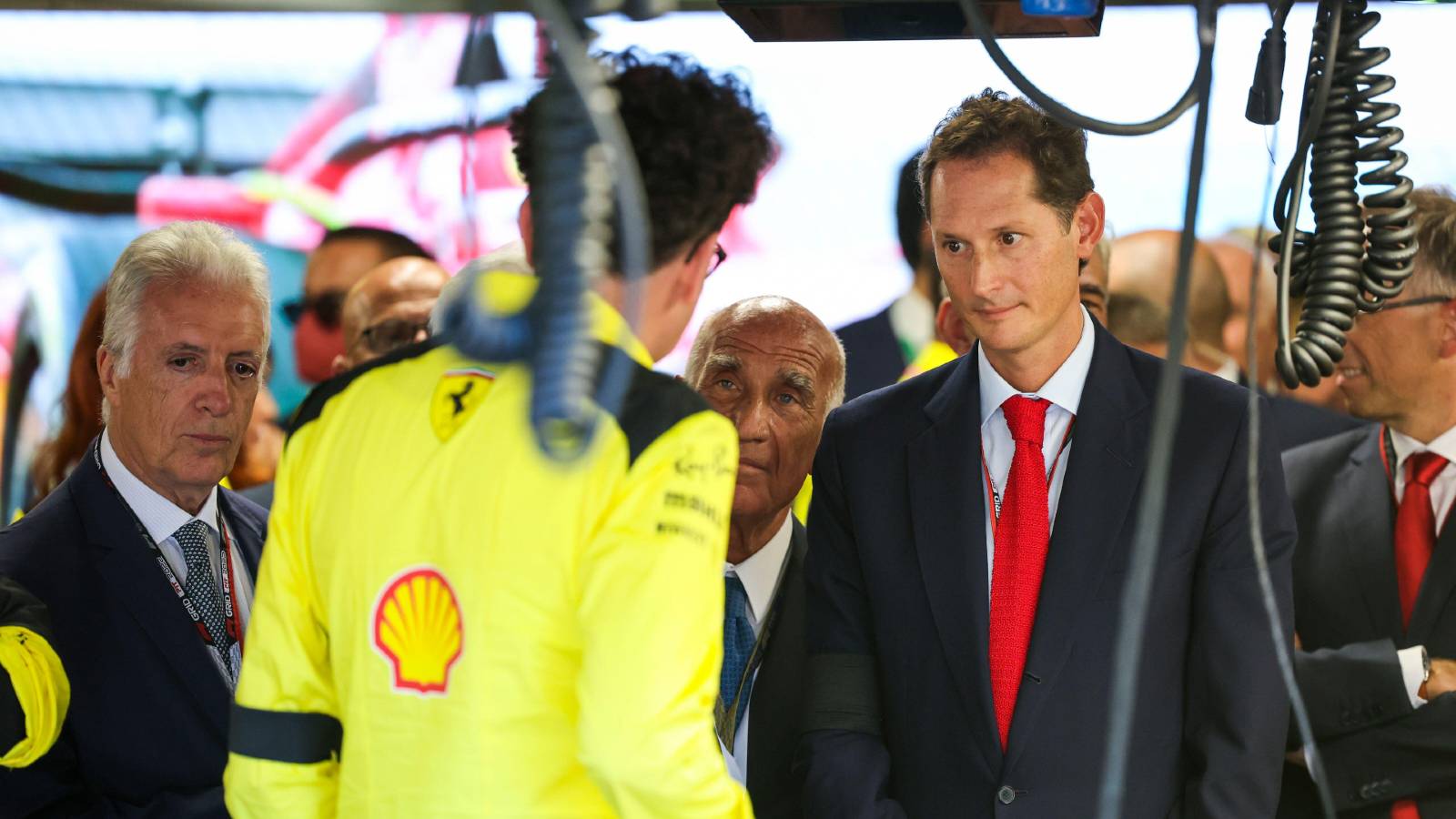 Mattia Binotto talking to Ferrari bigwigs at the Italian GP. Monza September 2022.