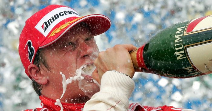 Kimi Raikkonen drinking champagne on the podium. Interlagos October 2007.