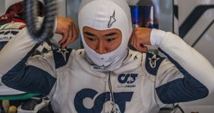 Yuki Tsunoda adjusting his race suit. Italy September 2022
