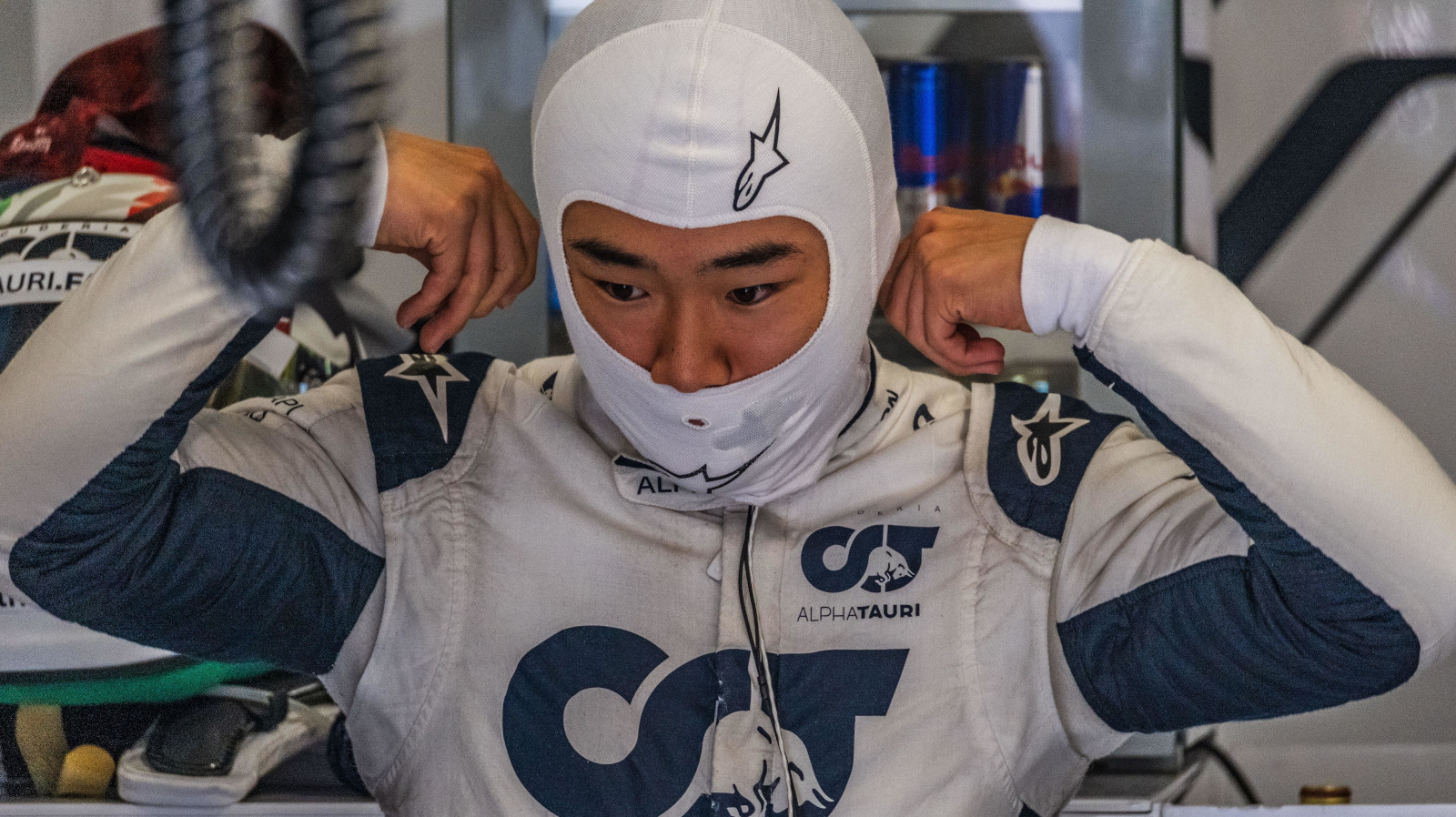 Yuki Tsunoda adjusting his race suit. Italy September 2022