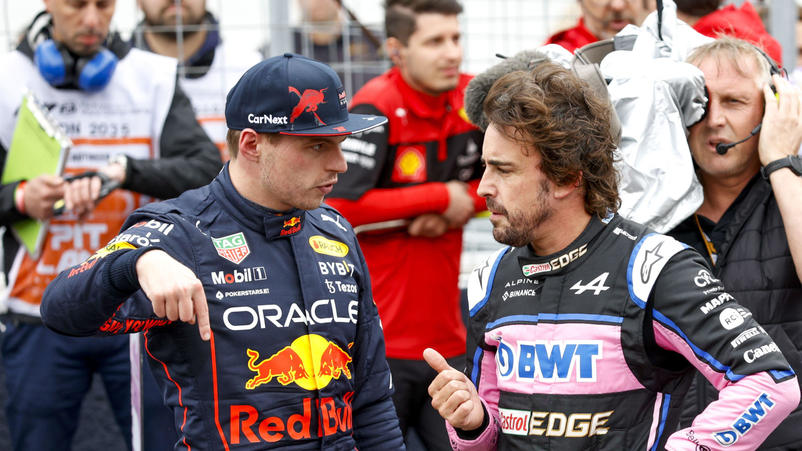 Max Verstappen discussing something with Fernando Alonso. Canada June 2022