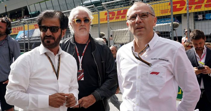 Flavio Briatore between Mohammed ben Sulayem and Stefano Domenicali. Red Bull Ring July 2022.