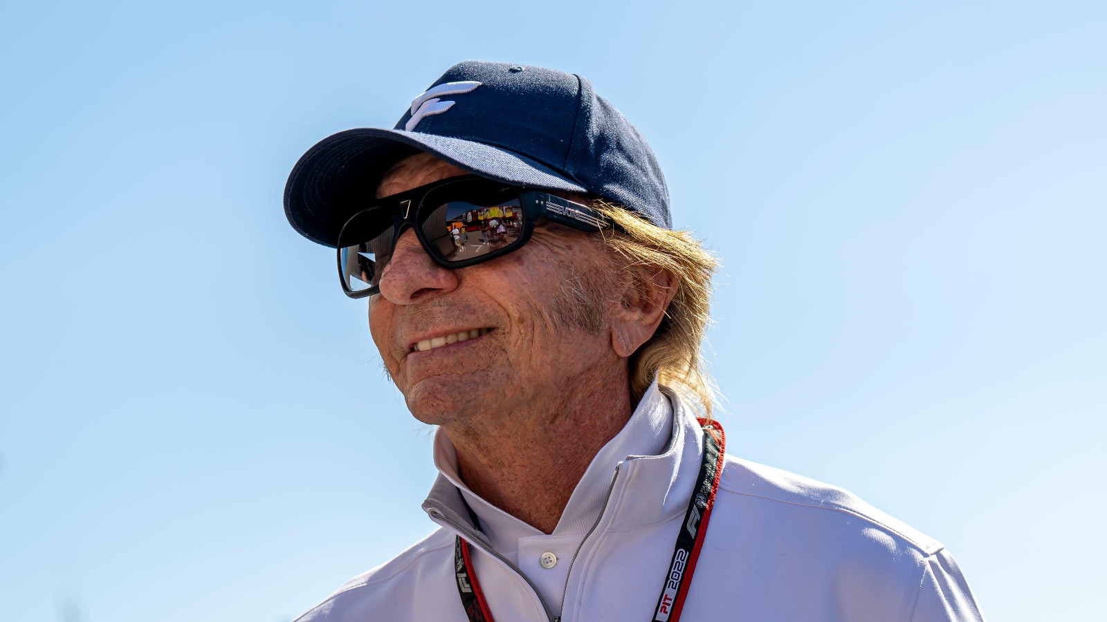 Emerson Fittipaldi in the paddock, wearing sunglasses. Italy, September 2022.