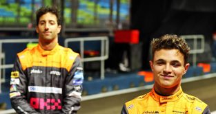 Daniel Ricciardo, McLaren, looks subdued, team-mate Lando Norris smiles. Singapore, September 2022.