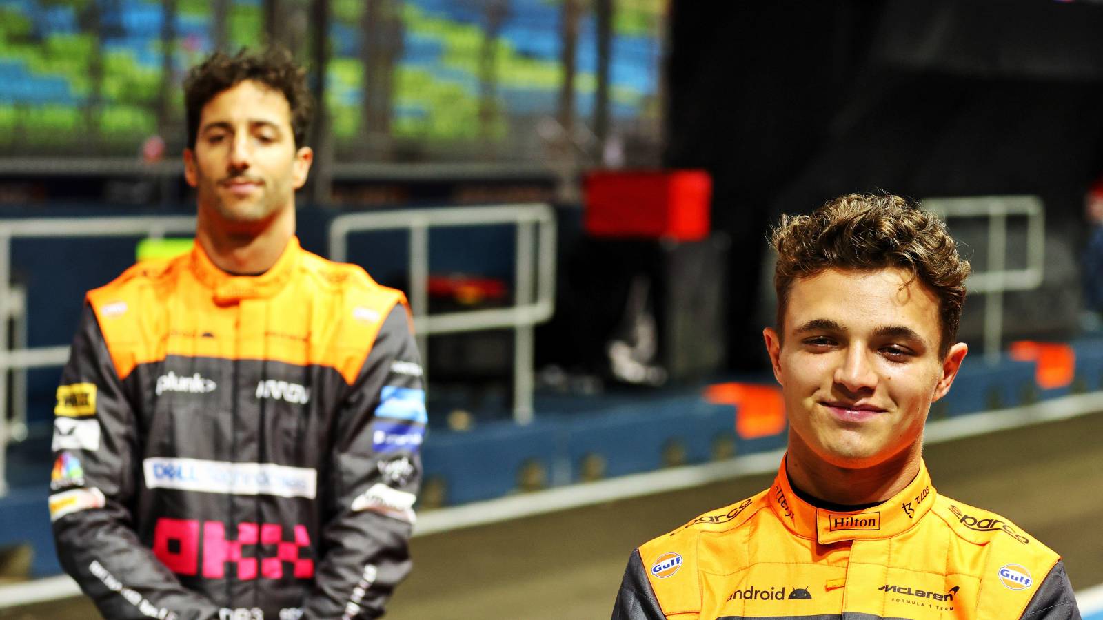 Daniel Ricciardo, McLaren, looks subdued, team-mate Lando Norris smiles. Singapore, September 2022.