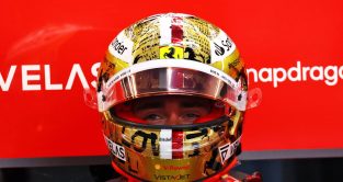 Charles Leclerc, helmet on, in the Ferrari garage. Singapore, September 2022.