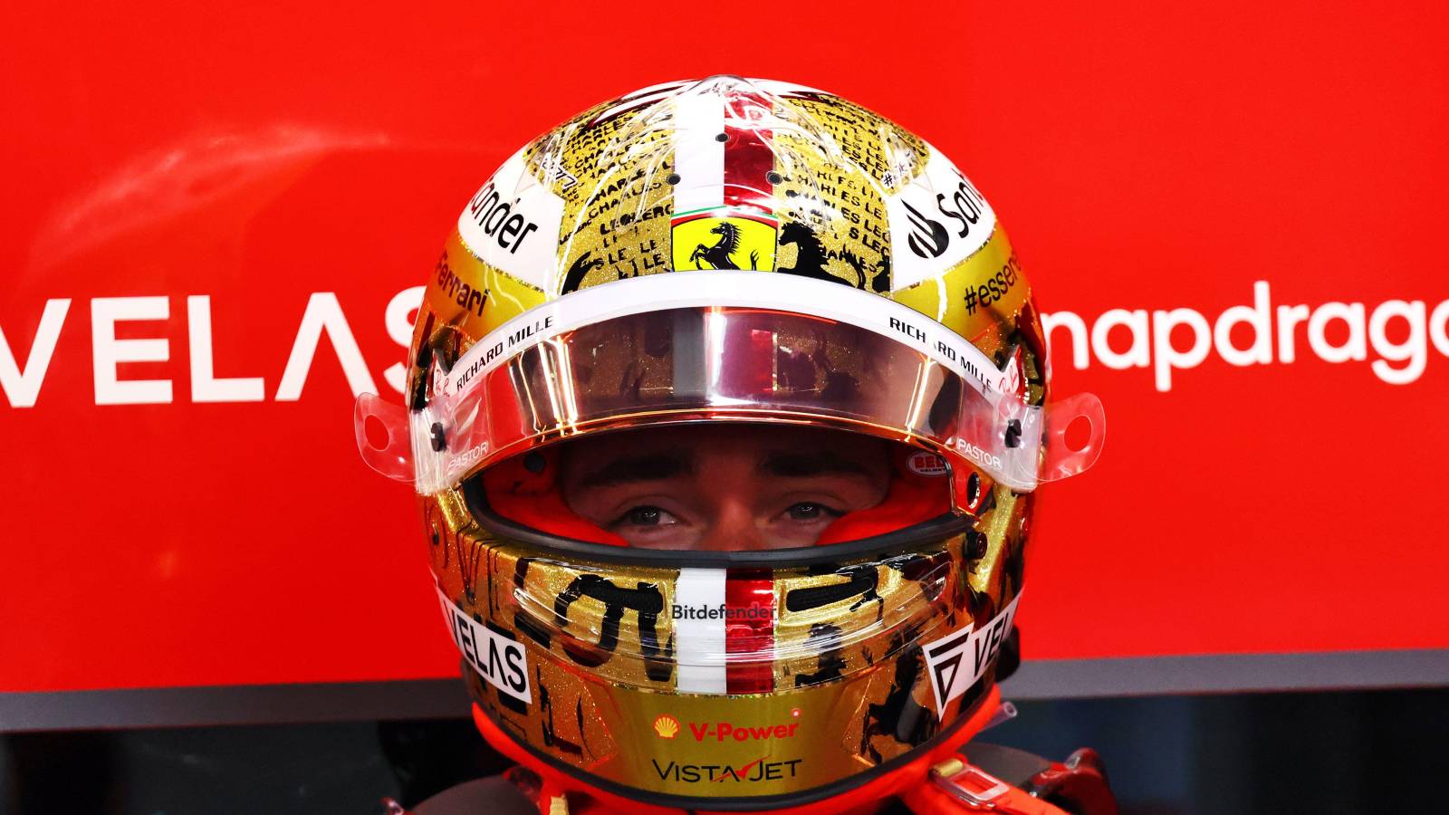 Charles Leclerc, helmet on, in the Ferrari garage. Singapore, September 2022.