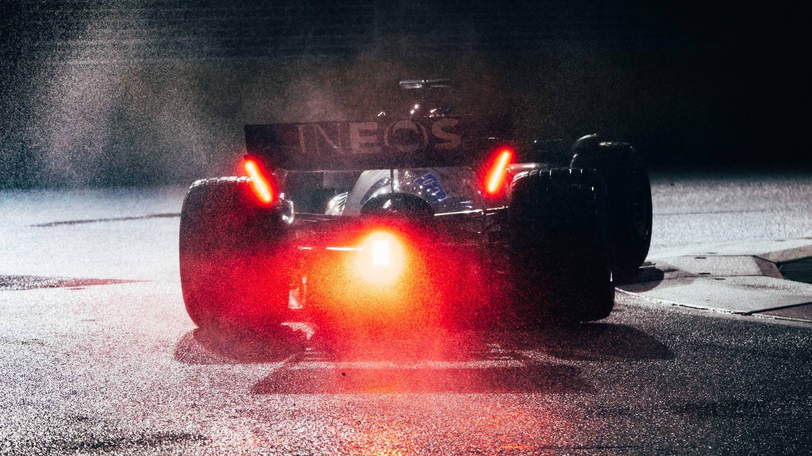 Spray as George Russell drives the Mercedes. Singapore, October 2022.