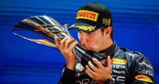 Sergio Perez kisses the trophy. Singapore October 2022.