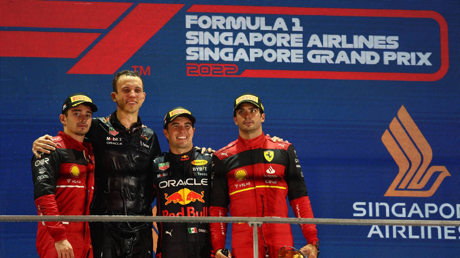 Sergio Perez, Charles Leclerc and Carlos Sainz on the podium after the Singapore GP. Marina Bay October 2022.