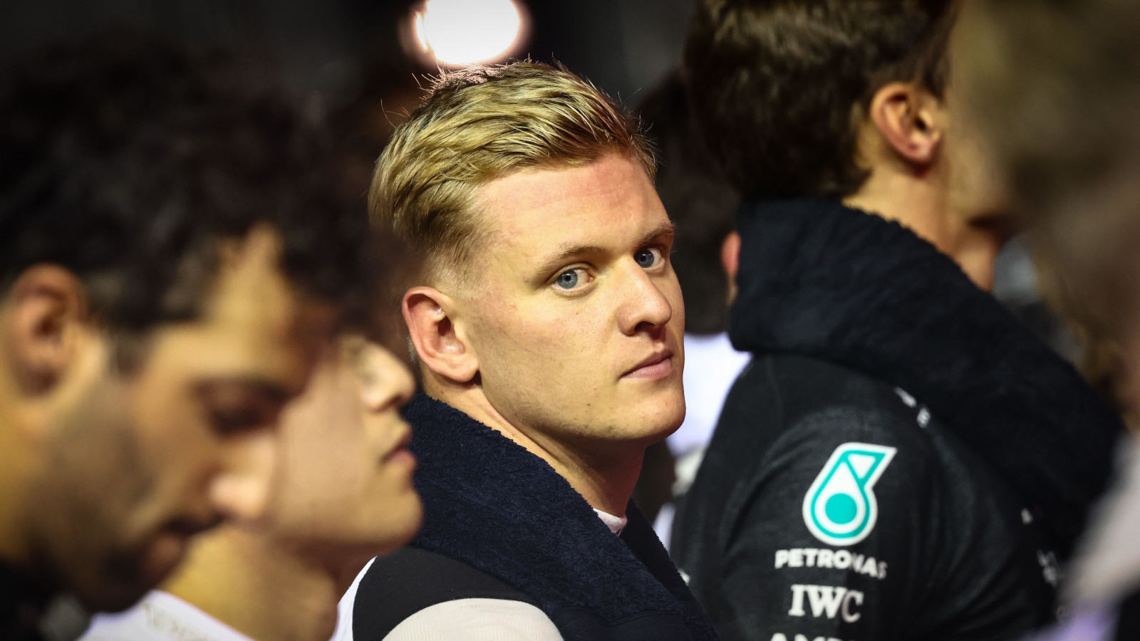 Mick Schumacher on the grid with Daniel Ricciardo and George Russell. Singapore October 2022