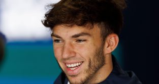 Pierre Gasly smiles in the garage. October 2022.
