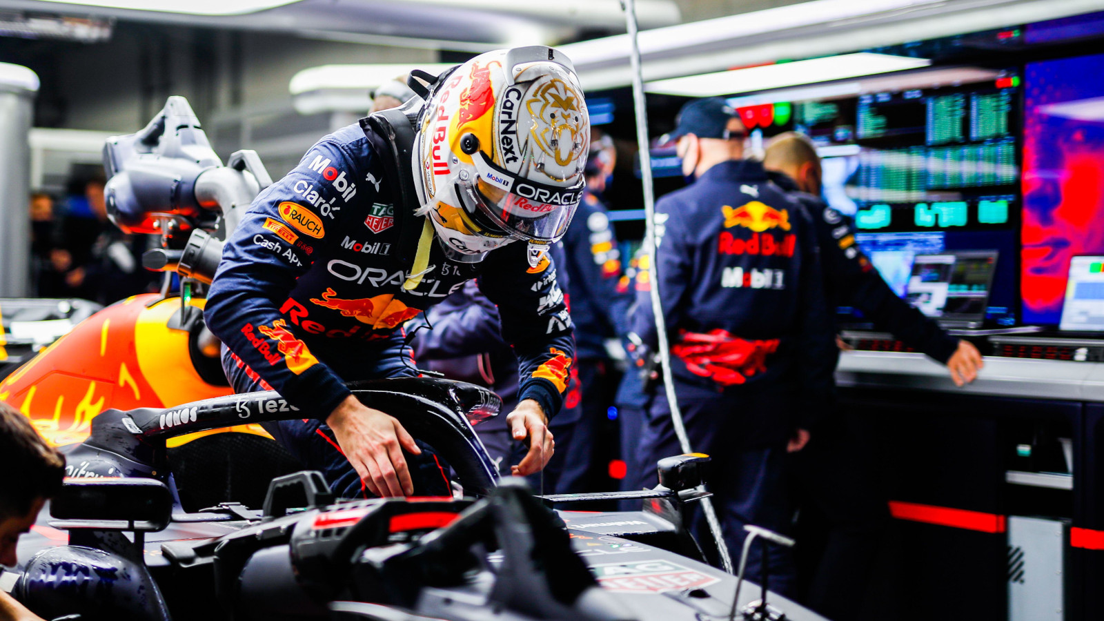 Max Verstappen climbs into his RB18. Japan October 2022