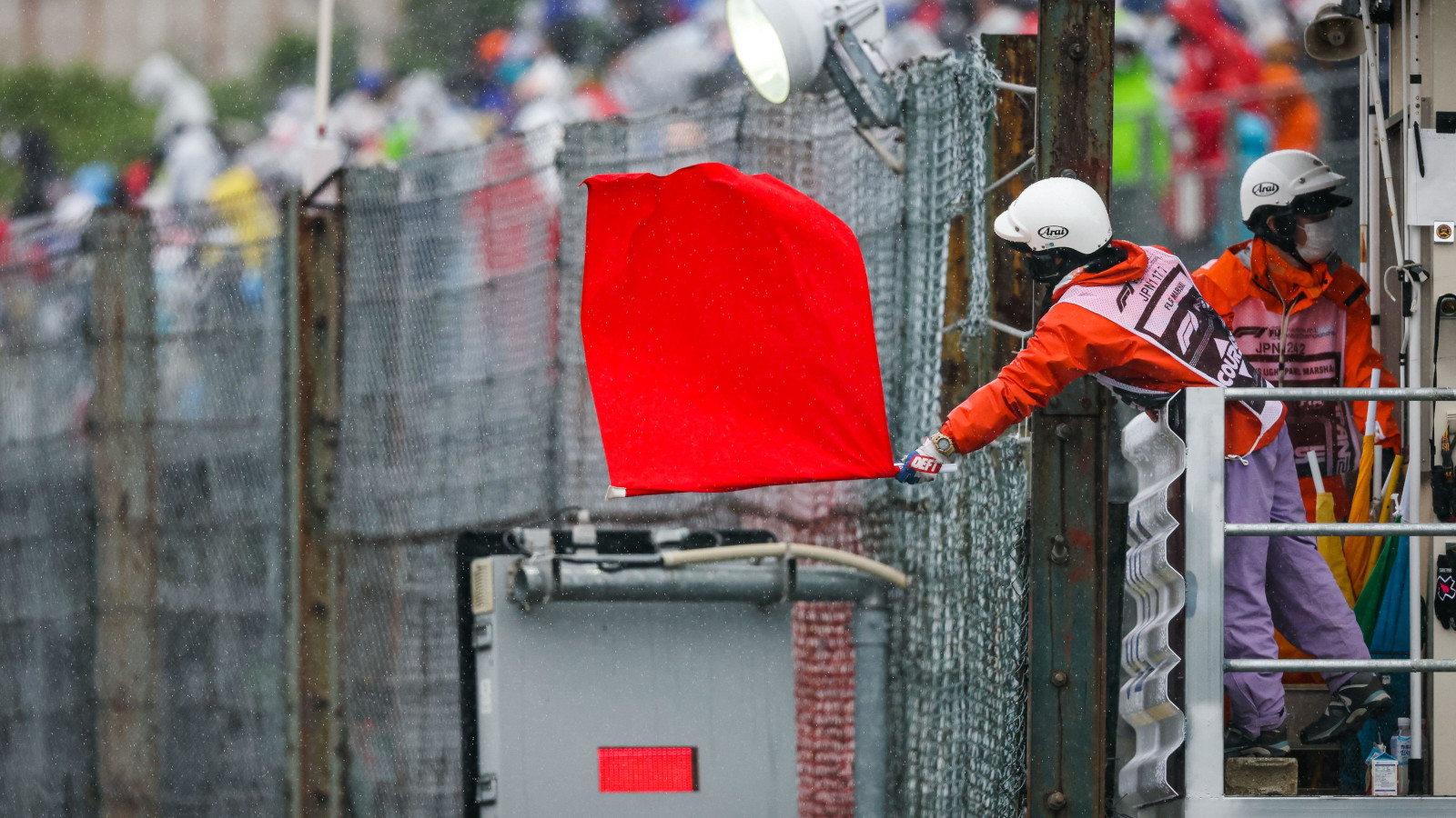 Red flag waved by a marshal at Suzuka. Japan October 2022