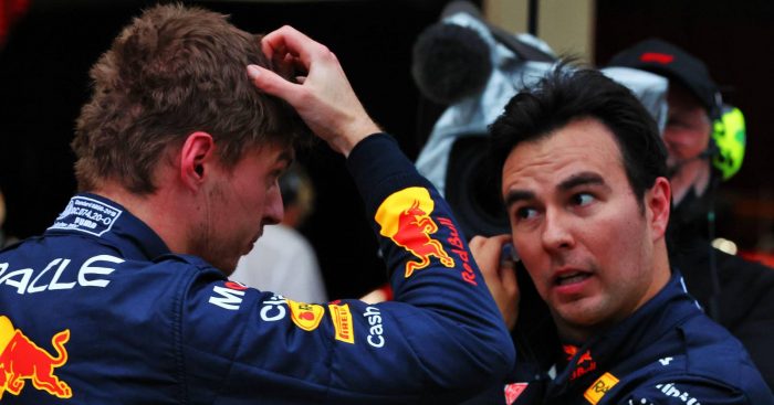 Max Verstappen, Red Bull, scratching head next to Sergio Perez. Suzuka October 2022.