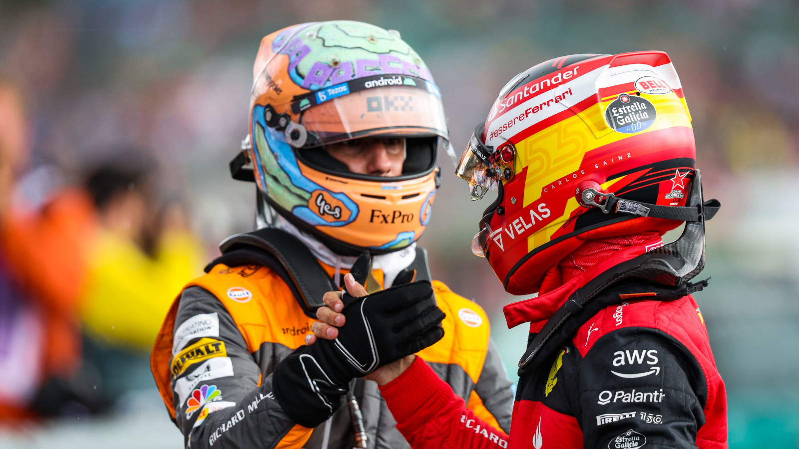 Daniel Ricciardo congratulates Carlos Sainz after his British GP win. Silverstone July 2022