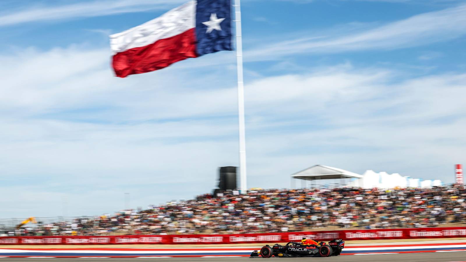 Max Verstappen's Red Bull in front of Lone Star flag at the US GP. Austin October 2022.