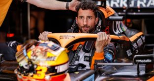 Daniel Ricciardo climbs in his car, serious face. Austin October 2022