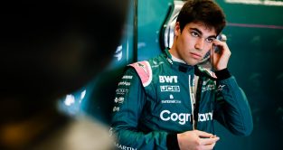 Lance Stroll putting his earpiece in. Austin, October 2022.