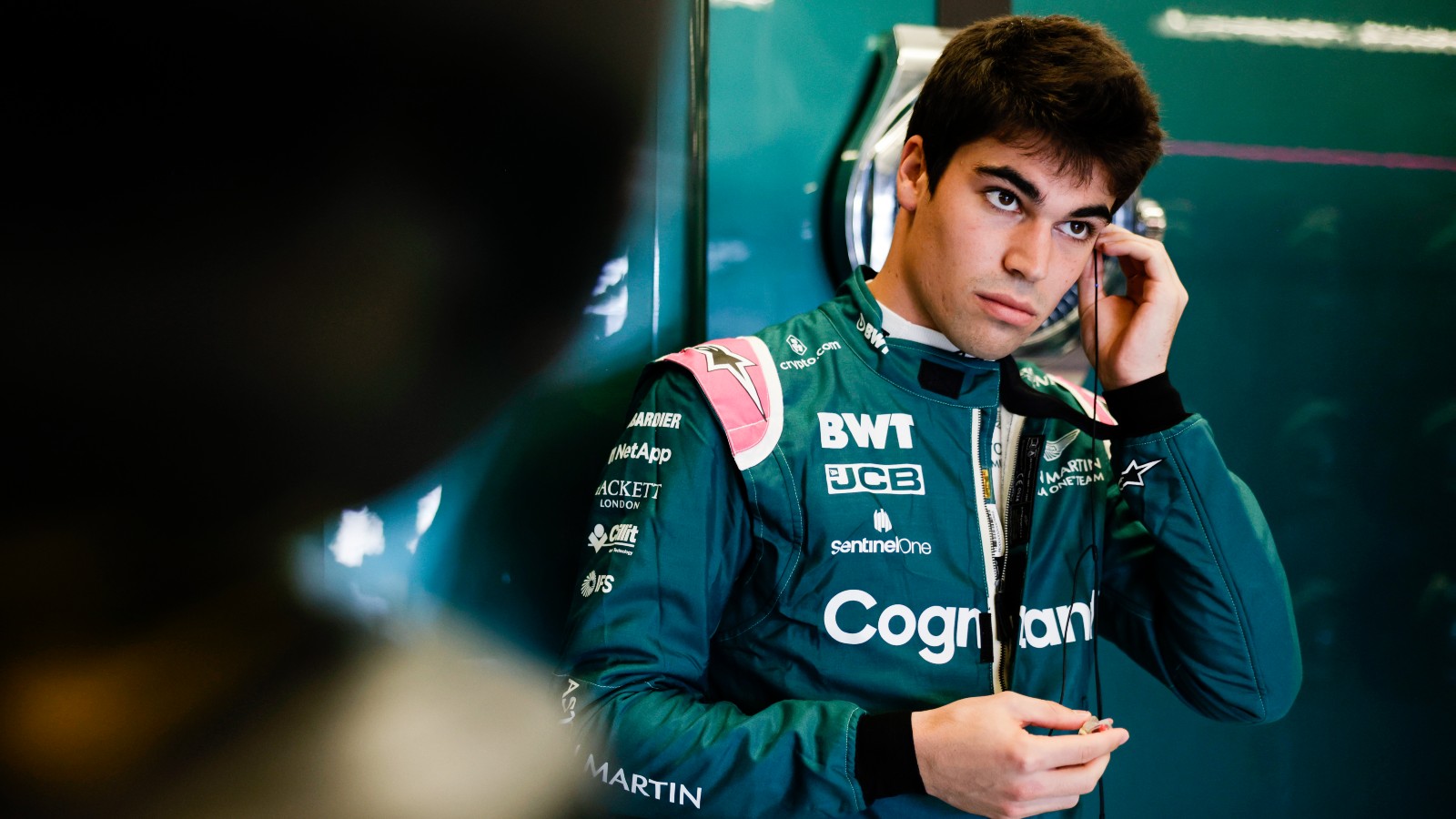 Lance Stroll putting his earpiece in. Austin, October 2022.