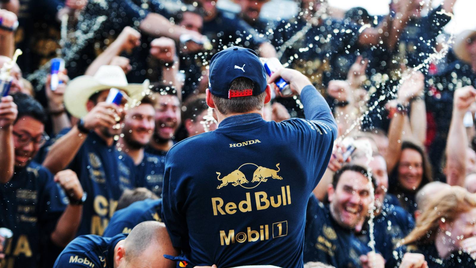 Max Verstappen sprays Red Bull in title celebration. United States, October 2022.