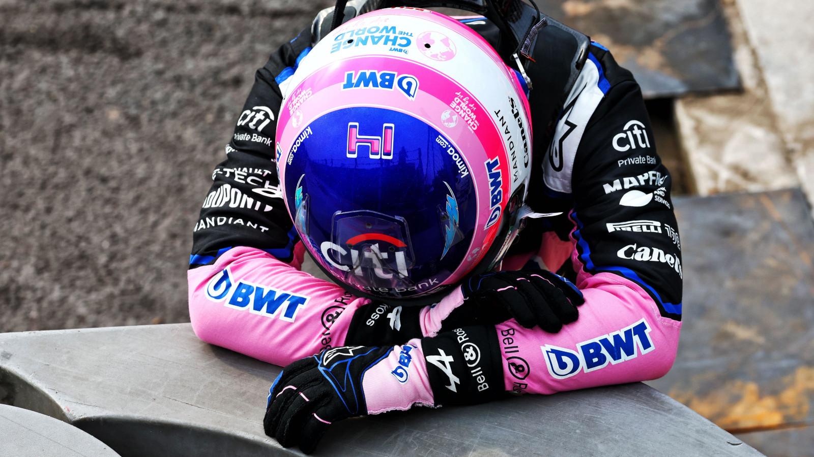 Fernando Alonso collapses in frustration after yet another mechanical failure.