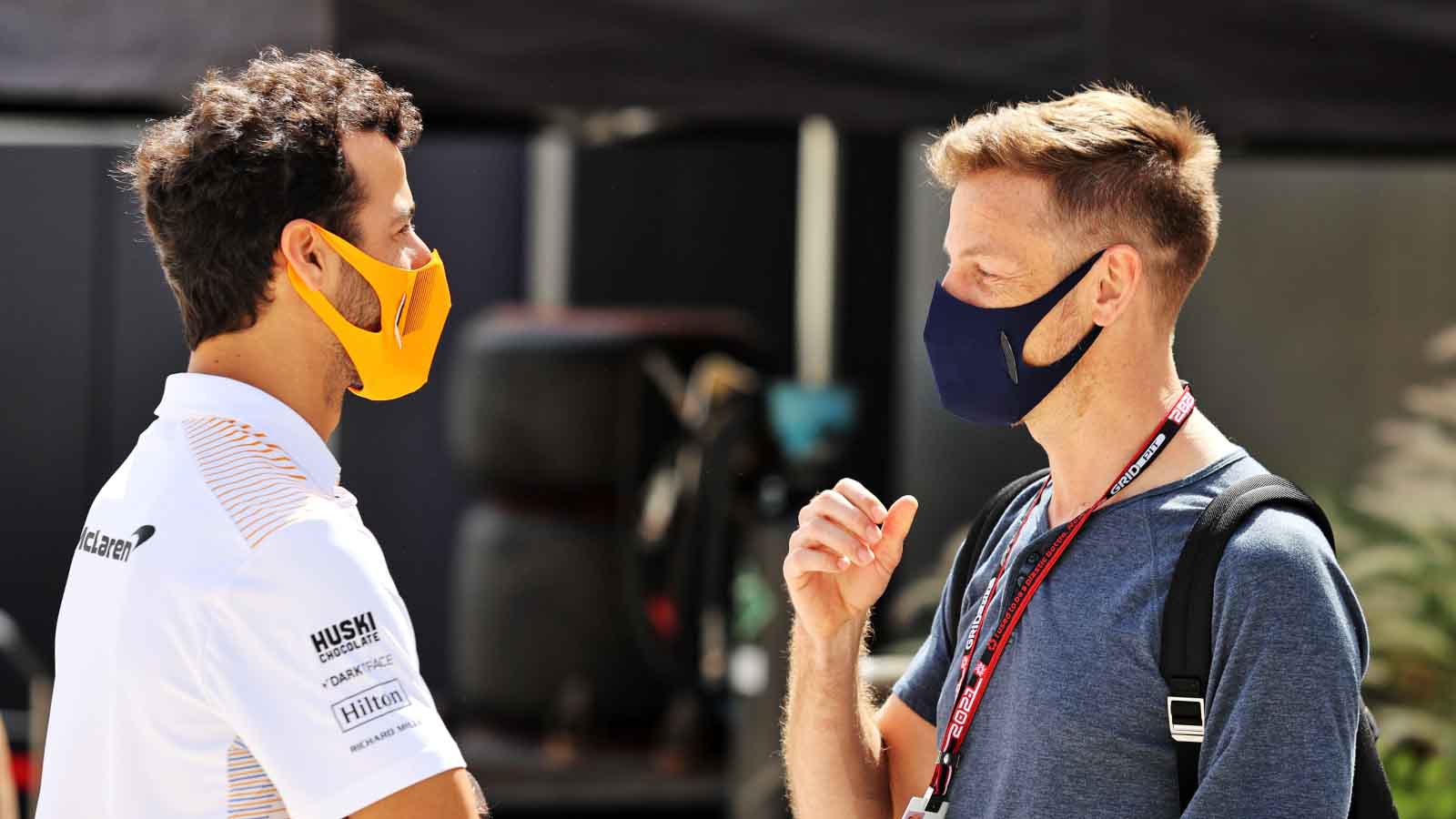 Jenson Button and Daniel Ricciardo speak. Bahrain March 2021.