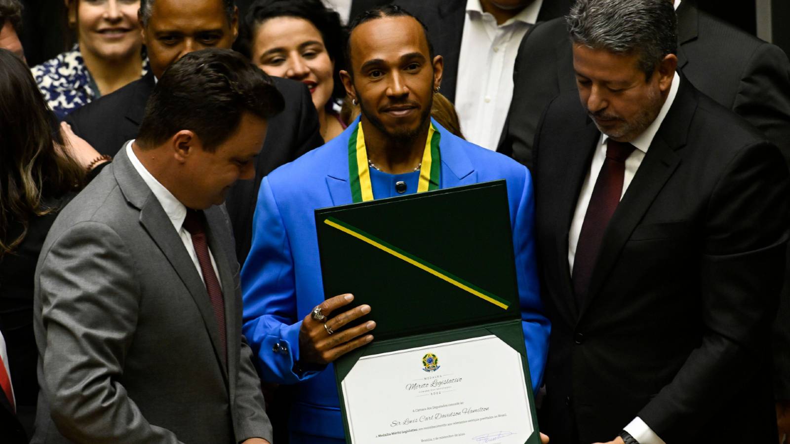 Lewis Hamilton holding Brazilian citizenship diploma. Brasilia November 2022.