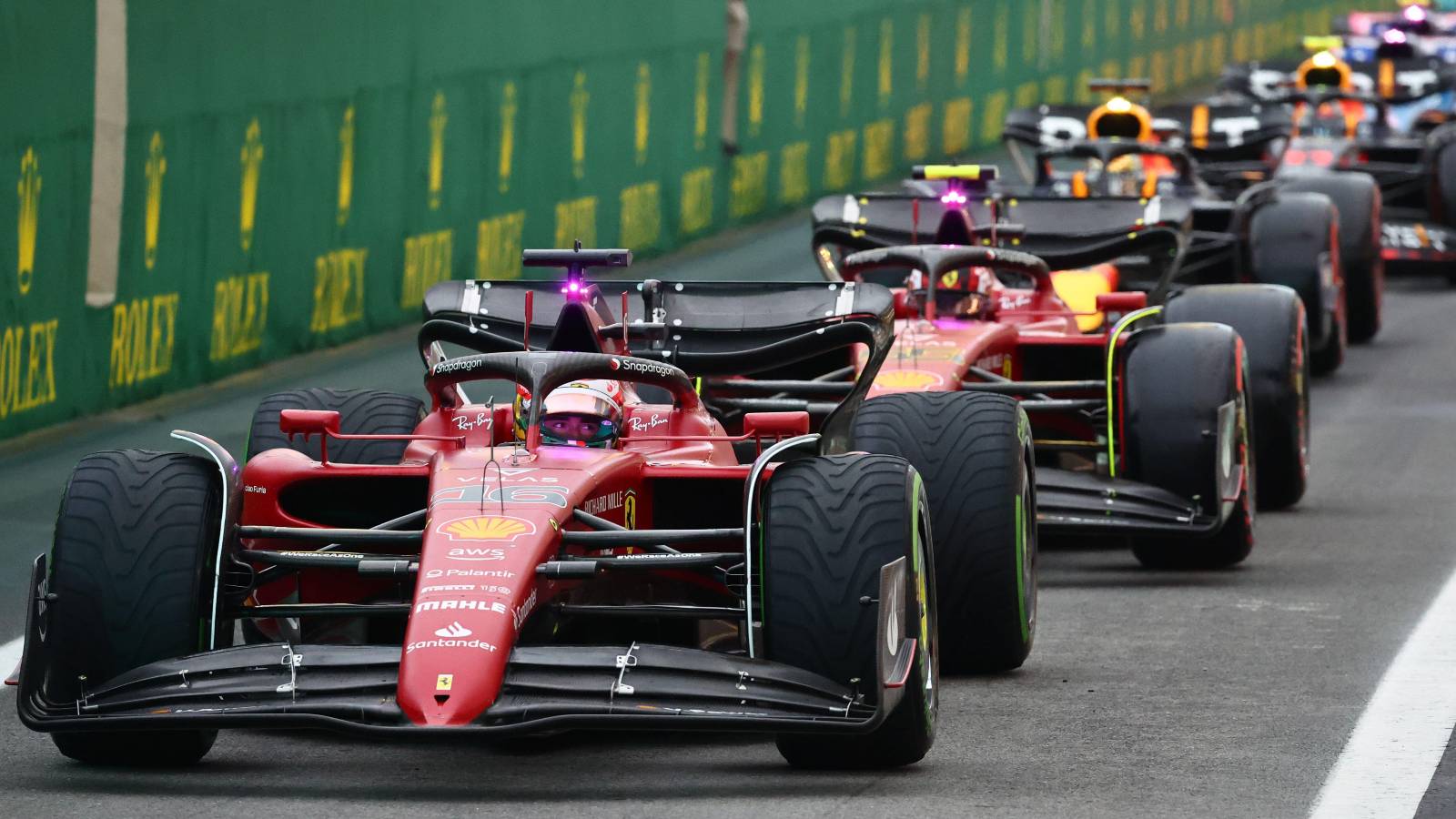 Charles Leclerc, Ferrari, heads pit-lane queue. Brazil, November 2022.