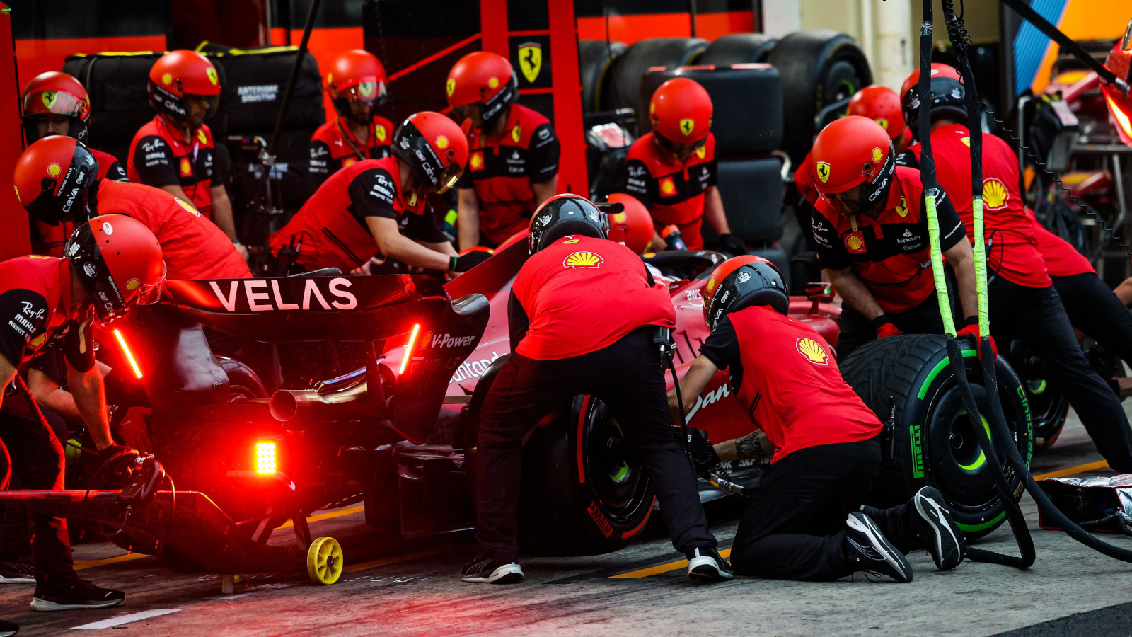 Charles Leclerc pits to swap from intermediate tyres to slicks on his Ferrari. Brazil November 2022
