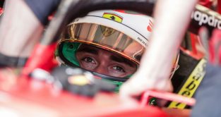 Charles Leclerc up close eyes focused sitting in his Ferrari. Brazil November 2022
