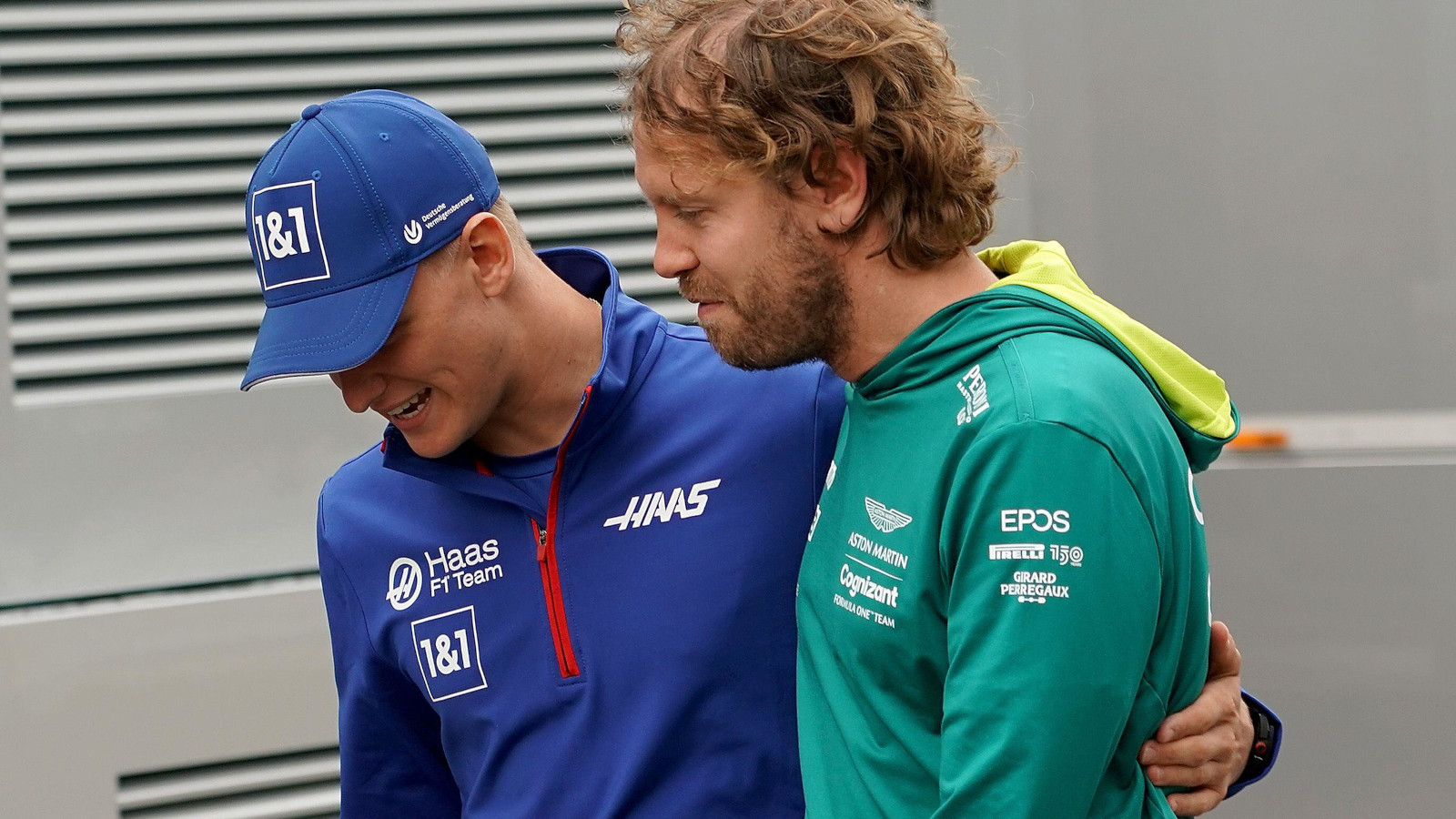 Mick Schumacher with his arm around Sebastian Vettel. Austria July 2022