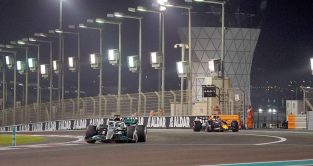 George Russell, Mercedes, followed by Max Verstappen, Red Bull. Abu Dhabi, November 2022.