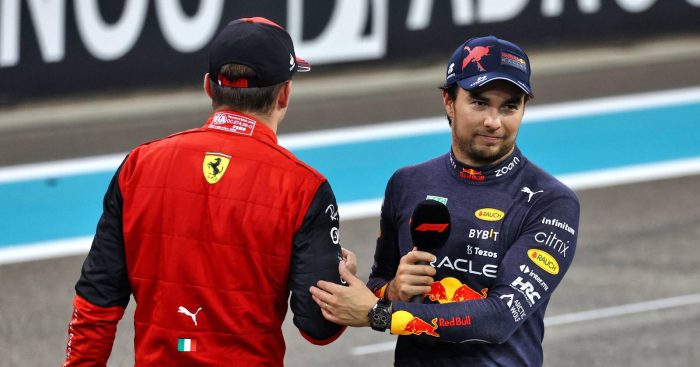 Charles Leclerc, Ferrari and Sergio Perez, Red Bull, acknowledge each other. Abu Dhabi, November 2022.