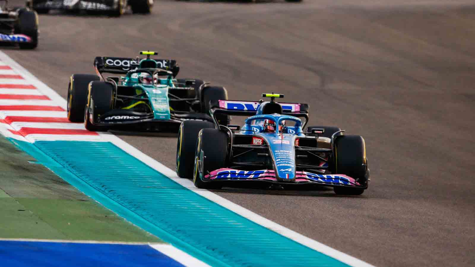 Esteban Ocon leads Sebastian Vettel. Abu Dhabi November 2022.