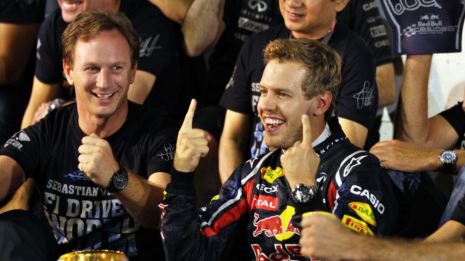 Christian Horner smiles at Sebastian Vettel. Suzuka, October 2011.